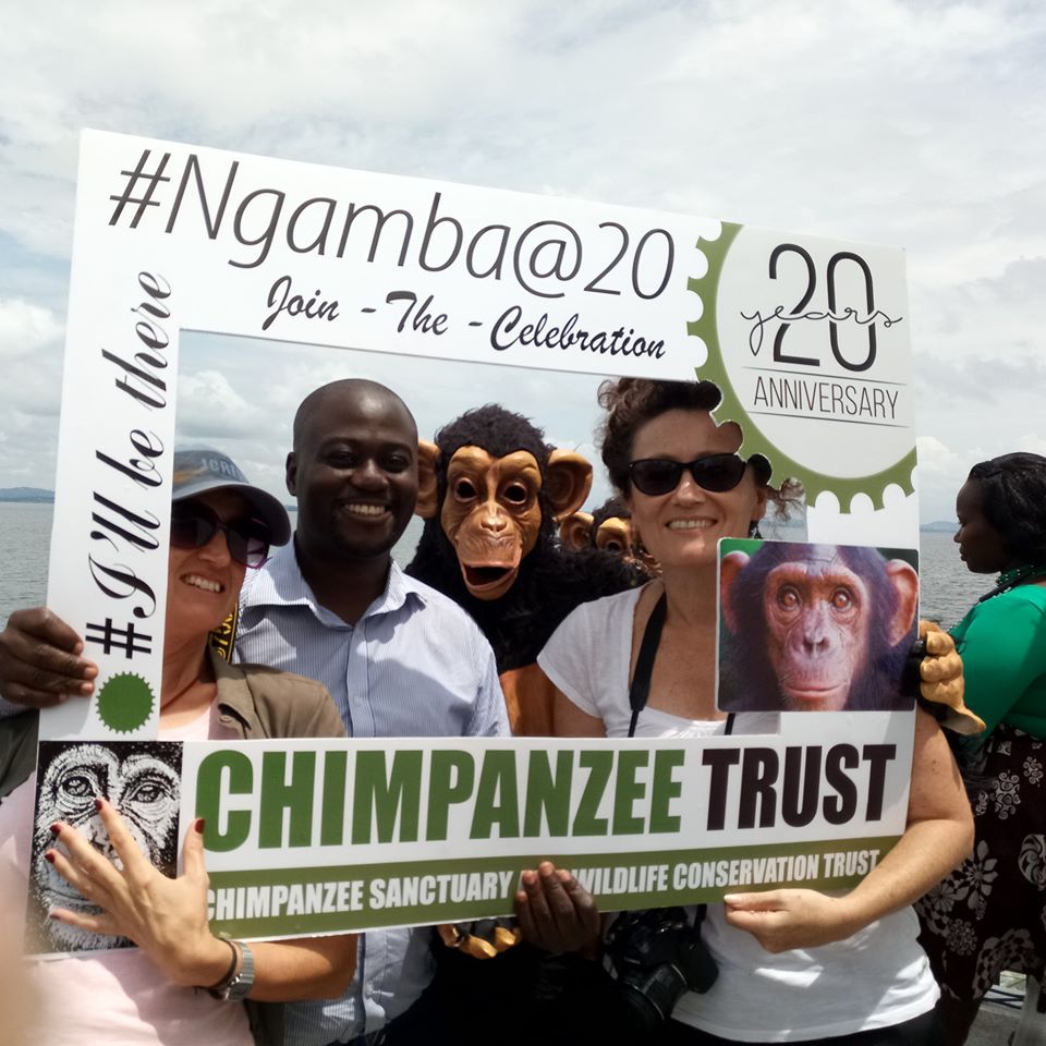 In celebratory mood at Ngamba Island Chimpanzee Sanctuary, with mascots and conservationist friends Julia Lloyd and Charlotte Beauvoisin. This was at the celebrations to mark 20 years of the sanctuary's existence. It cares for orphaned chimpanzees.