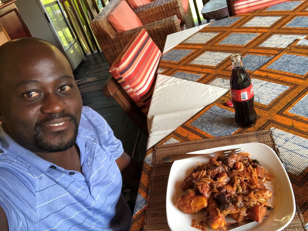 Your photographer takes a selfie before digging into a pan-fried serving. Uganda is a foodie’s paradise with so many culinary options. Selfie by EDGAR R. BATTE.